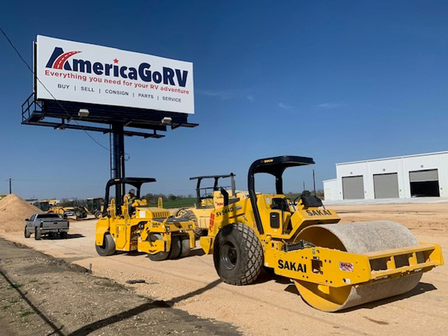 heavy equipment preparing a road for paving